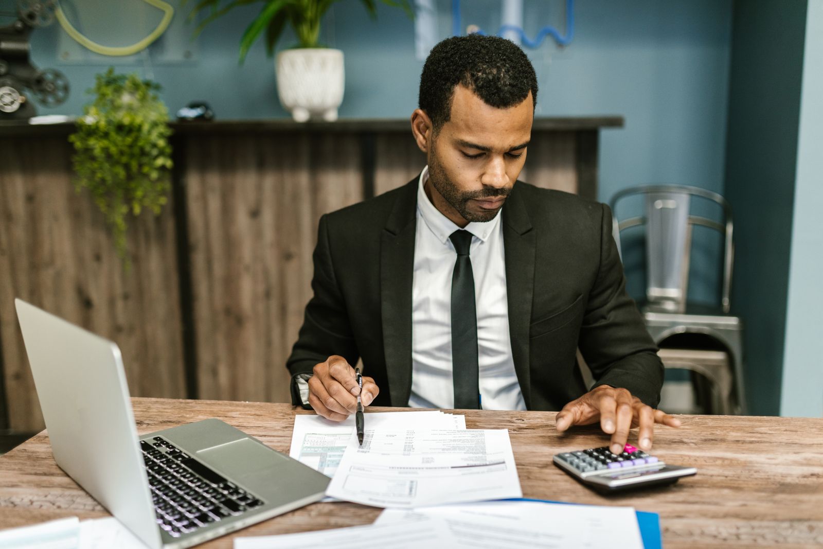 A professional reviewing documents at a desk, representing accurate, polished signing work.