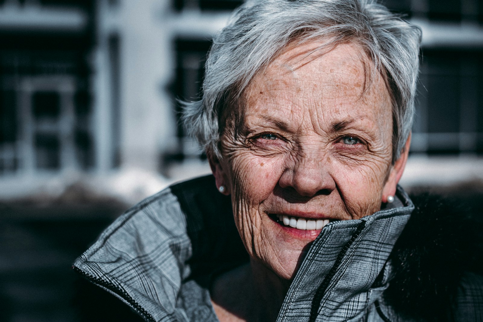 An elderly woman photographed with warmth and dignity.
